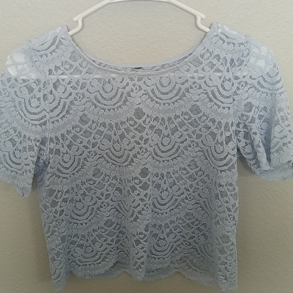 A cropped baby blue shirt